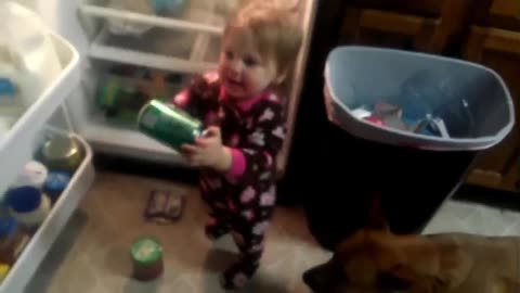 cute baby sneaks into the refrigerator