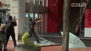 May 1 portland may day 1.12 antifa throws flare into building police tell them to leave