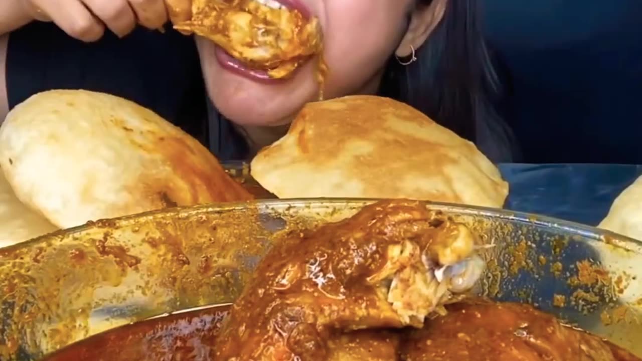 Chicken curry with Puri eating