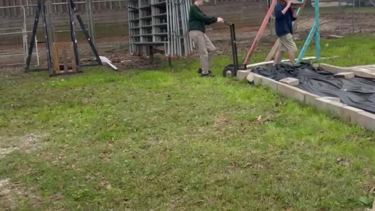 Farmer Daniel Pulls the Handtruck