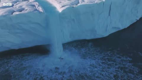 Kayaker's 20m drop down ice waterfall in Svalbard, Norway