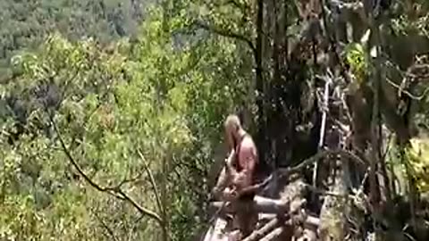 Building a small cave shelter in the woods