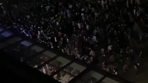 A crowd was forced off the runway and moved outside the airport. Four people were