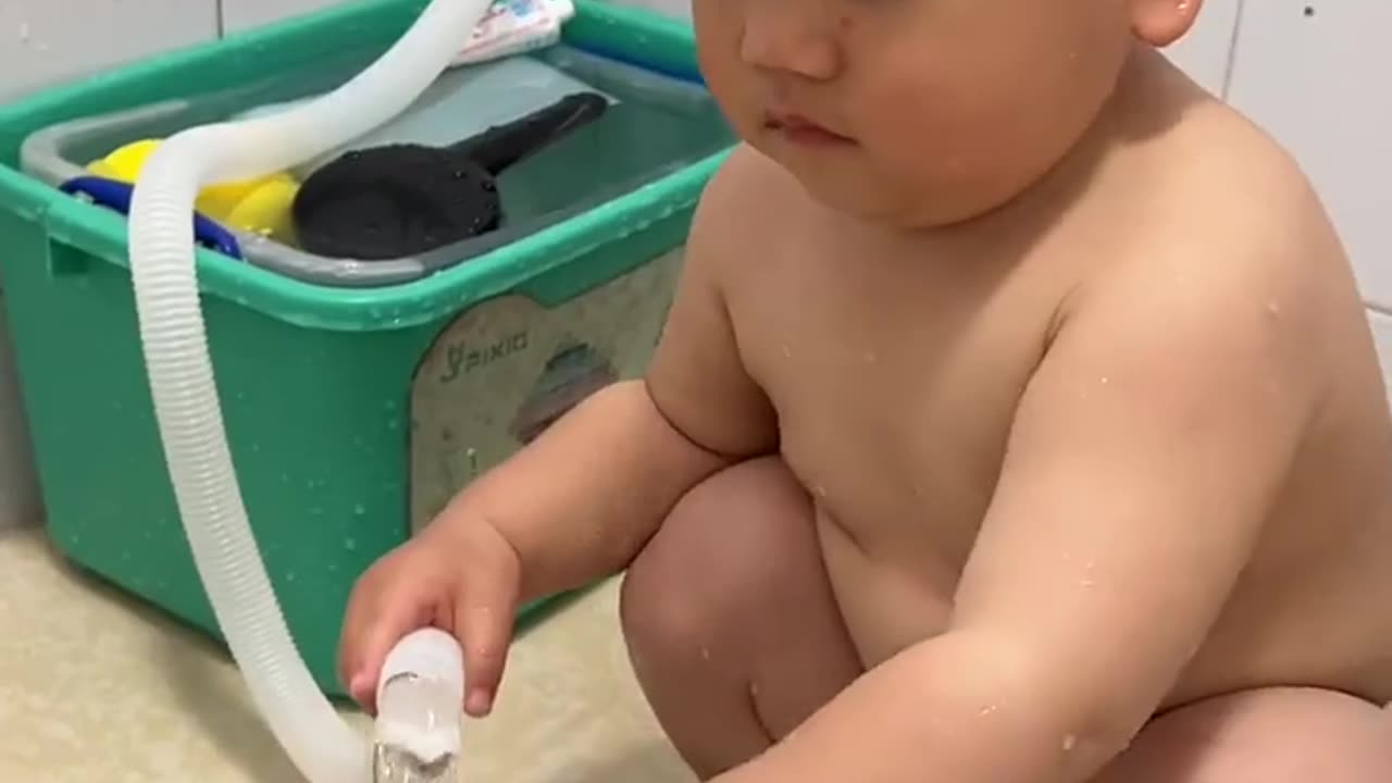 Child bathing his frog