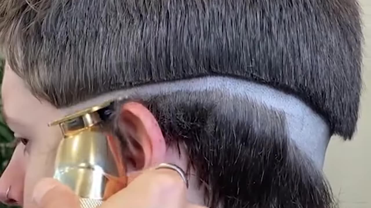 You have to watch this guy's new hairstyle!