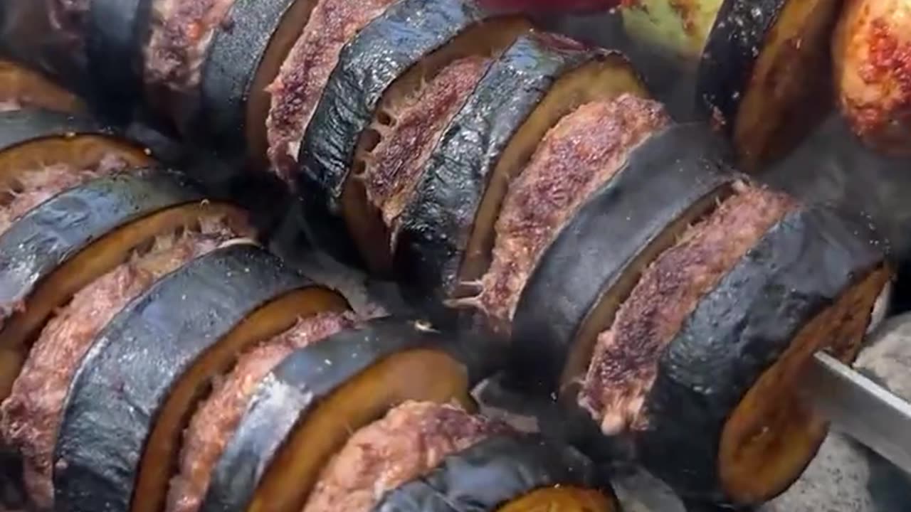 Family barbeque party with eggplant addition