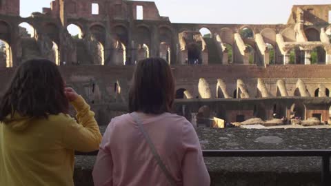 People Looking At the Colosseum