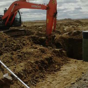 The excavator works with a frozen ground with a special bucket.