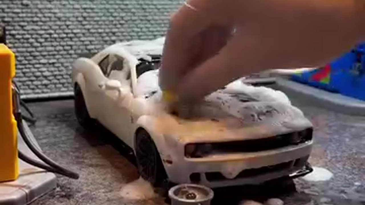 Working as a mechanic on miniature toy cars