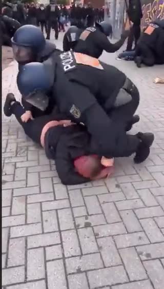 German police ruthlessly beating protesters