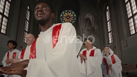 Church choir in white gowns making performance.