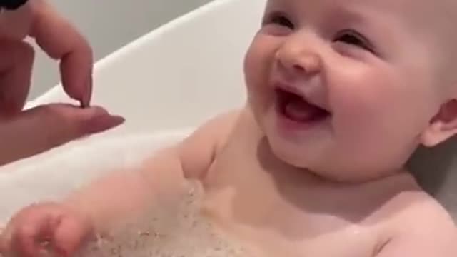 Baby gets super excited with red Pringles can