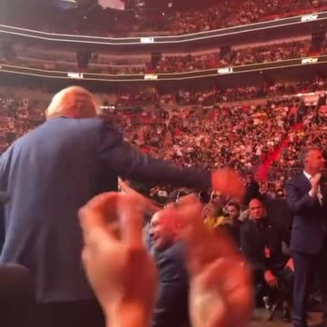 UFC crowd breaks out in USA! USA! USA! chant as Trump rises and waves at the area