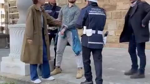 Mayor of Florence Dario Nardella stops an "environmental activist" who daubed paint on the facade...
