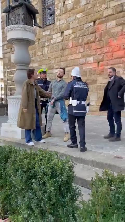 Mayor of Florence Dario Nardella stops an "environmental activist" who daubed paint on the facade...