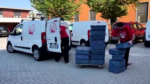 Volunteers deliver food to elderly in Milan heatwave