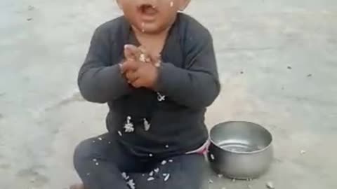 Cute baby eating rise