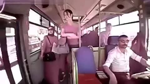 chick walks out of moving bus.