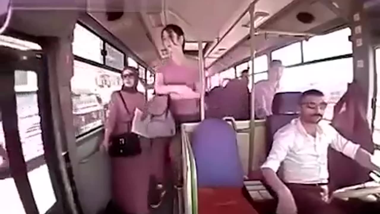 chick walks out of moving bus.