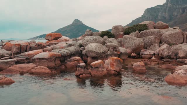 Boulders Of Rock Lying Along The Coastline Of The Sea In Cape Town, South Africa