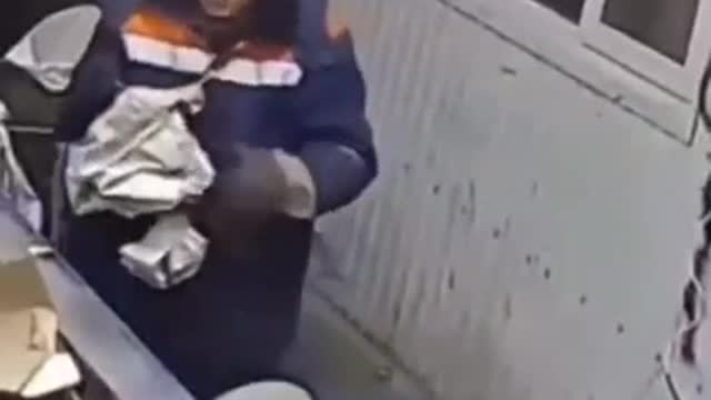 This guy saving kitten from trash cutting machine.