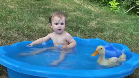 Funny Baby Reaction to Duckling in the Pool