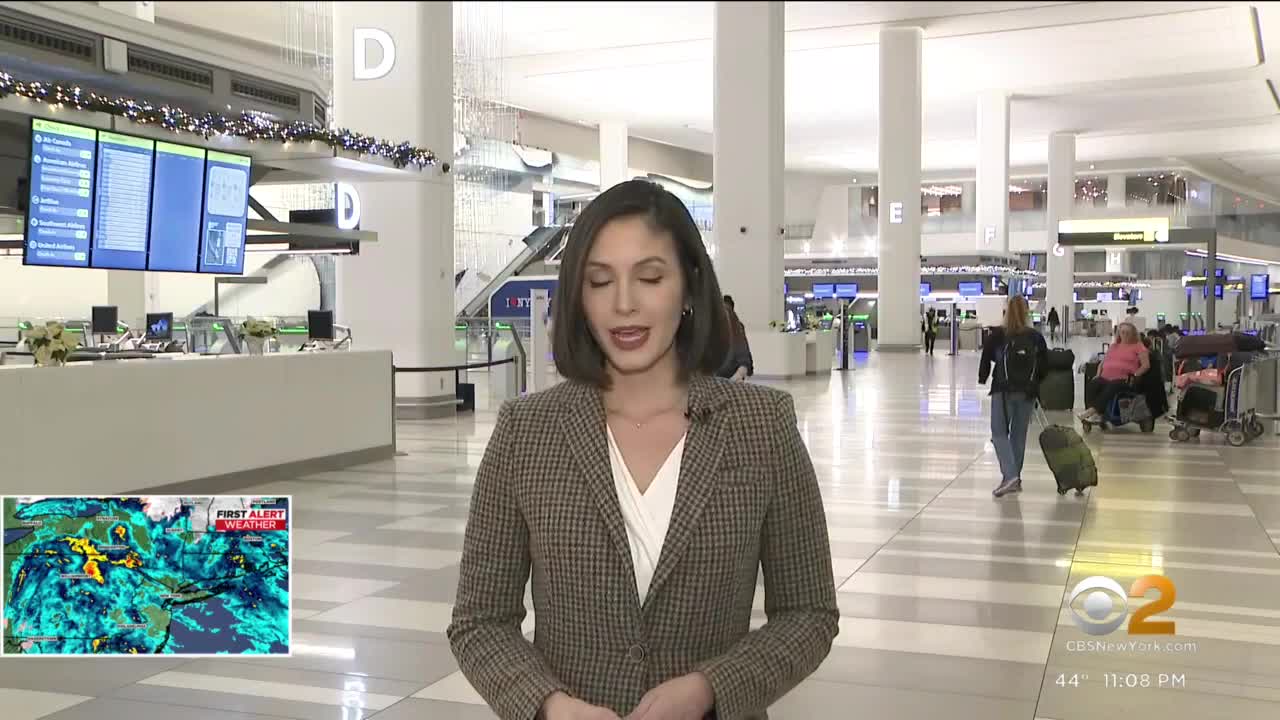 Frustrated faces make their way through LaGuardia Airport
