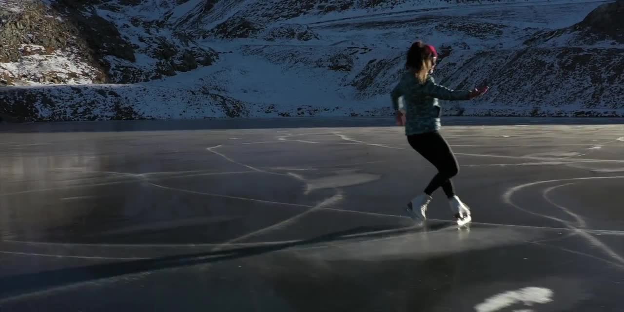 ICE SKATING ON A FROZEN LAKE - FRANCE