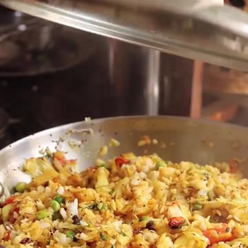 "Deliciously Spiced Morning Delight: Unveiling the Savory Magic of Poha"