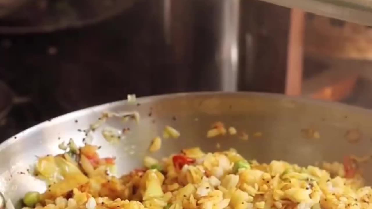 "Deliciously Spiced Morning Delight: Unveiling the Savory Magic of Poha"