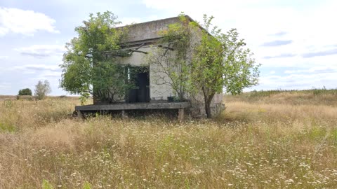 The building behind the abandoned farm