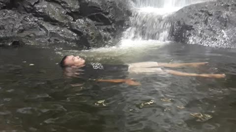 float in the waterfall pool