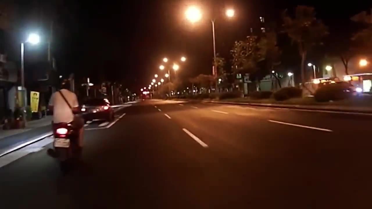 Scooter Crashes into Parked Car