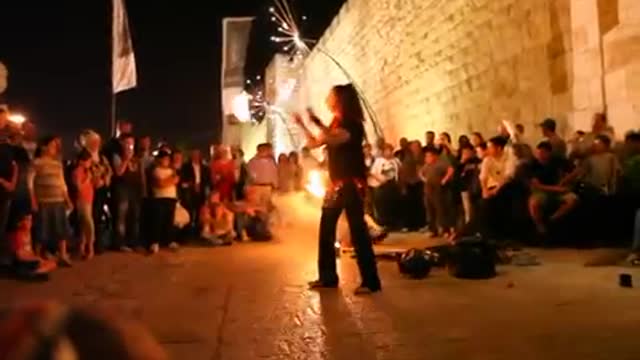 Girls juggling with fire, at the Jerusalem Festival of Lights