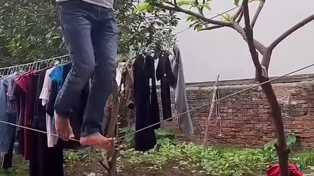 The man with amazing balance on a fragile rope