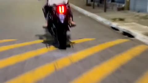 He learns to drive a motorcycle and almost causes danger to his friend