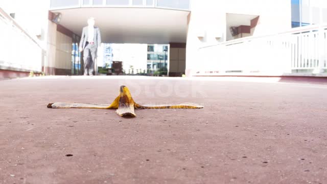 Businessman walking towards bananaskin