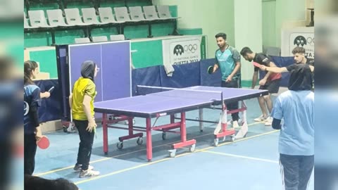 Girls and boys Playing table tennis.