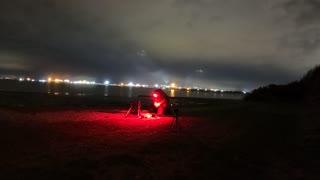 Nightlapse. Packing away the Trekology Yizo go camping chair. Next to a river