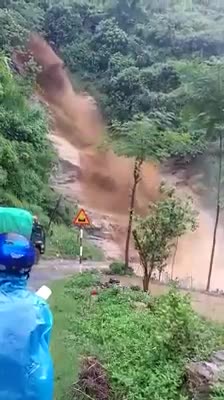 Chopper footage of damage from flash flooding and mudslides strand vehicles in Lao cai County