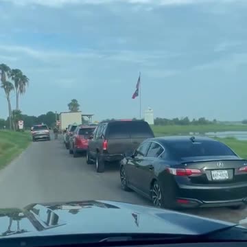 This is a Line of Family Members and Sponsors waiting to pick up illegal migrants at Texas Border