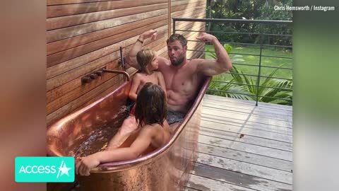 Chris Hemsworth Flexes Muscles During Outdoor Bath w His Twins