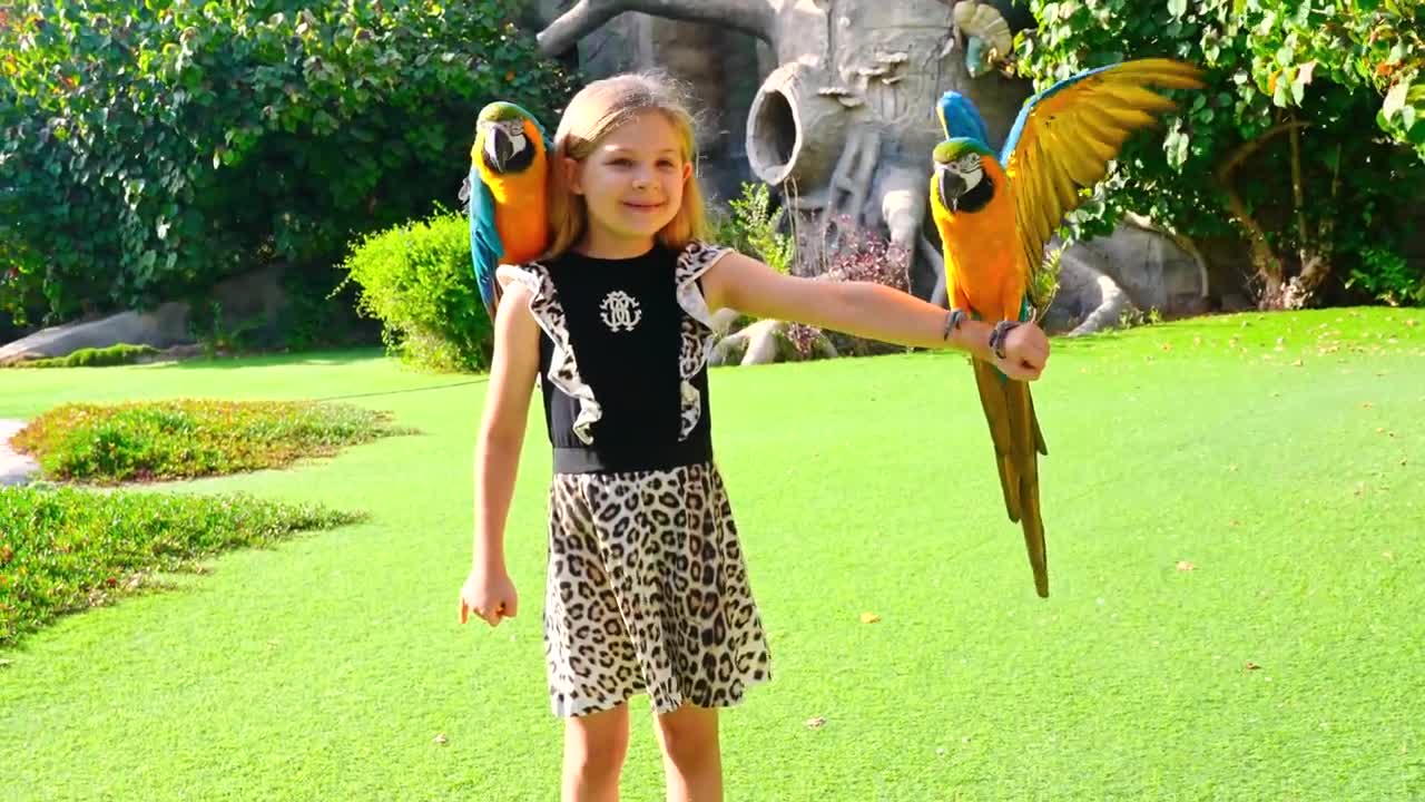 Diana and Roma feed the animals at the Emirates Park Zoo