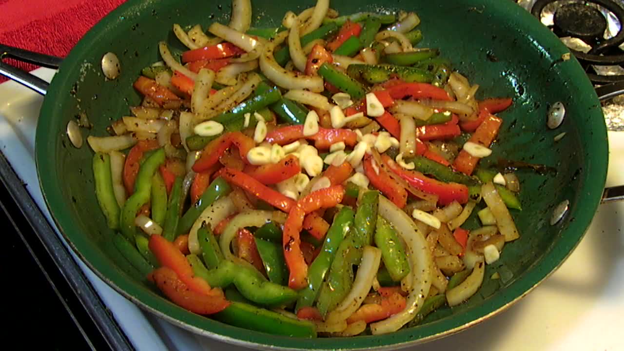 Cajun Andouille Sausage, Peppers and Onions over Spaghetti