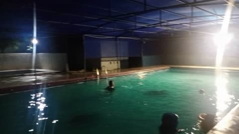 in Swimming pool with Kids An Family