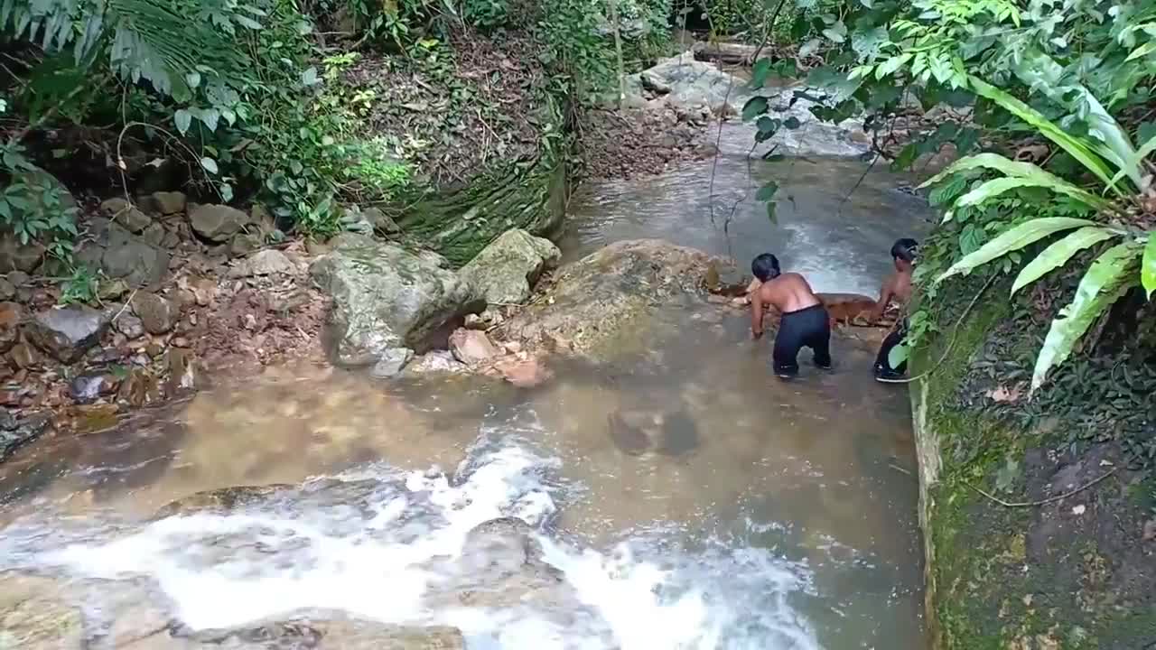 Build a swimming pool at a waterfall by wild people and their daily life