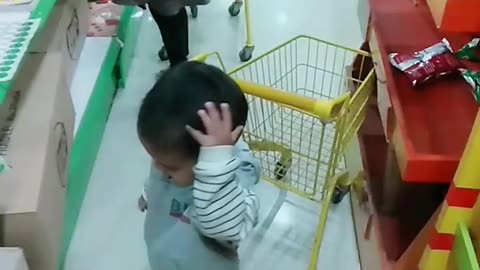 Baby doing shopping