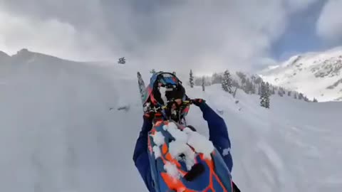 Guy Ejects From Snowmobile Mid-Air While Performing Backflip