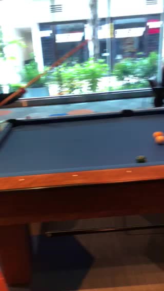 My daughter playing pool