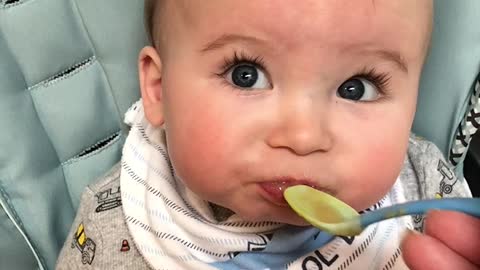 Little Baby Makes Funny Faces as He Tries New Food